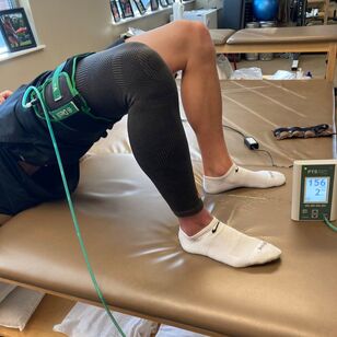 Athlete performing blood flow restriction training in Physical Therapy - Asheville Physical Therapy